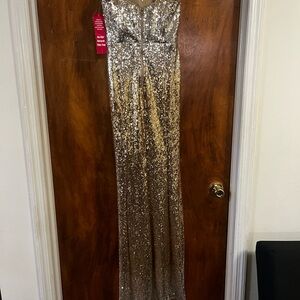 New with tags, worn once—gold sparkly dress, size 5, in excellent condition.